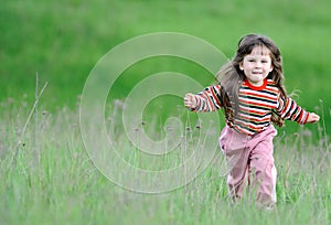 The running girl on a green field