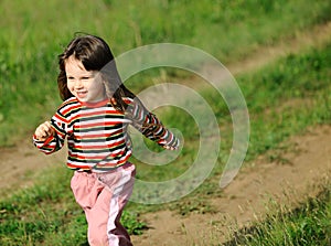 The running girl on a green field