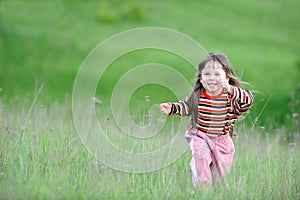 The running girl on a green field