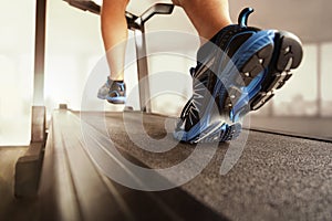 Running in a gym on treadmill