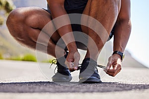 Running, hands or person on road with shoes for fitness exercise, workout and marathon training. Closeup, tying lace or