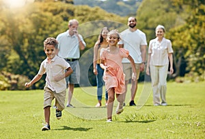 Running, happy and summer with big family in park for happy, freedom and health. Nature, spring and environment with