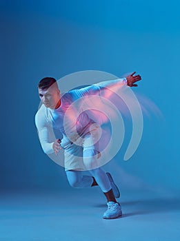 Running , healthy lifestyle concept. Young man in white sportswear running.