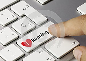 Running - Inscription on White Keyboard Key