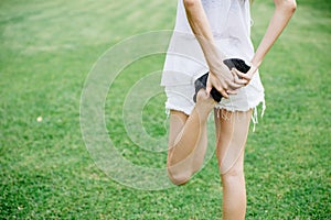 Running or jogging woman warm up leg