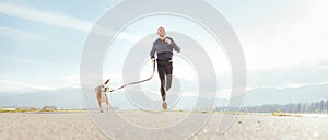 Running man with his dog . Active healthy lifestyle concept image