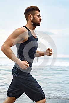 Running Man Jogging At Beach During Fitness Workout Outdoor. Sport