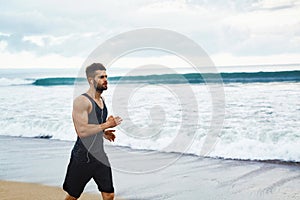 Running Man Jogging At Beach During Fitness Workout Outdoor. Sport