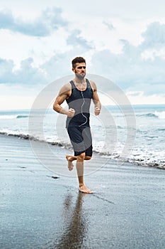 Running Man Jogging At Beach During Fitness Workout Outdoor. Sport