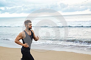 Running Man Jogging At Beach During Fitness Workout Outdoor. Sports