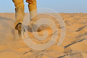 Running man on the sand in the desert