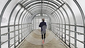 Running Man In Sportswear Workout Before Triathlon, Sprinting In Glass Tunnel.