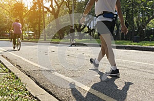 Running man walking exercise at public park .aerobic endurance training.selective focus