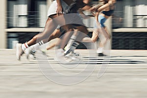 Running, motion and group of people on path together for marathon race, fitness and speed. Fast run team, urban runner