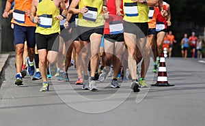 running race with feet and legs of many runners sports athletes