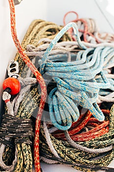 Pile of nautical marine ropes on yacht deck