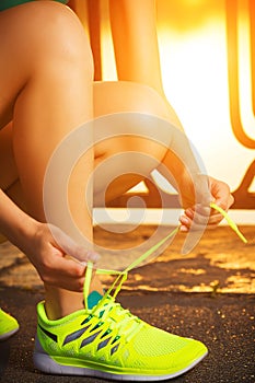 Running shoes. Barefoot running shoes closeup. Female athlete ty