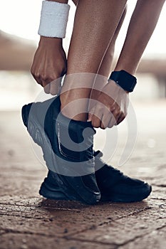 Running shoes, exercise and fitness woman with black sport shoe for training, workout and cardio outside. Closeup feet