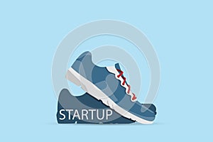 Running shoes with startup word, startup and business concept