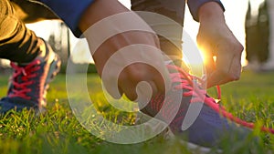 Running shoes - woman tying shoe laces