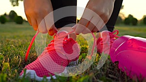 Running shoes - woman tying shoe laces