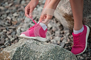 Running shoes - woman tying shoe laces.