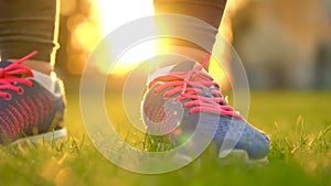 Running shoes - woman tying shoe laces. Slow motion