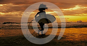 Running, silhouette and woman with a surfboard, beach and water with fitness, adventure and holiday. Person, girl or