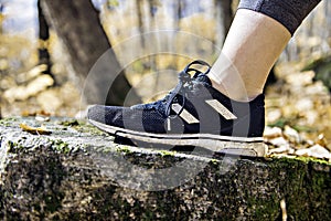 Running sport concept .Closeup of woman barefoot runner shoes. Female jogging on autumn