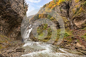 Running  stream from Cascada Del Estrecho  Estrecho waterfall in Ordesa valley, in Autumn season photo