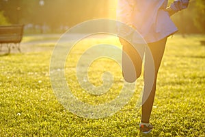 Running stretching - runner wearing smartwatch.