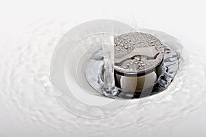 Running tap water in a sink down the drain