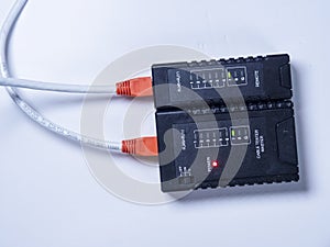 Running a test oa newly made up network cable with RJ45 at each end photo