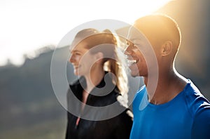 Running is the touchstone that breathes adventure into my soul. two athletes standing outdoors.