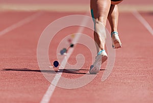 Running on track athlete to compete in long jump