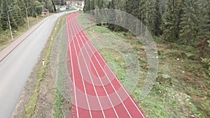 Running track with lanes. Athletics outdoor running treadmill. Sports field. Training sport base for athletes in mountains. Sport