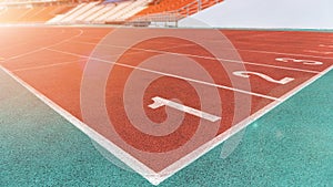 Running track race in sport arena in athletic game event for athletes with stadium for audiences and fans background photo