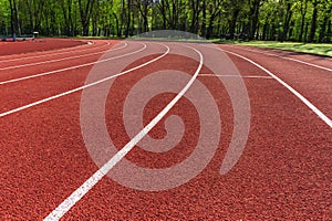 Running Track. Red treadmills at the stadium.