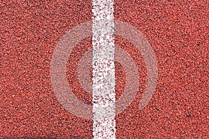 Running track sports texture. Running track rubber cover. Tartan track material is the trademarked all-weather synthetic track sur photo