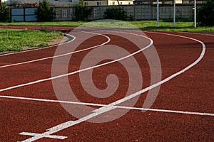 Running track in the stadium. Rubber coating. Treadmill in the fresh air. Healthy lifestyle concept. Athletes cardio