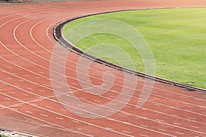 Running track in stadiums with grass