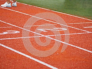 Running track on two three number rubber orange color