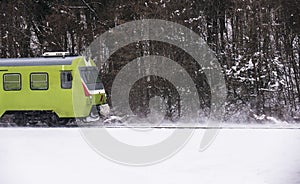 Running train on tracks covered with snow