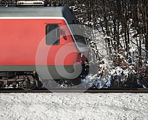 Running train on tracks in winter