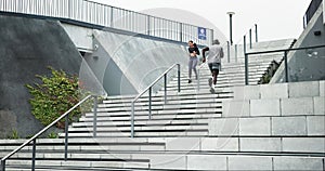 Running, training and stairs with woman in city for health, marathon fitness and challenge. Wellness, sports and workout