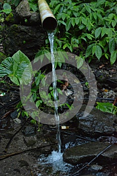 running water falls through the pipe view