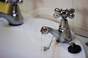 Running water from a faucet in bathroom