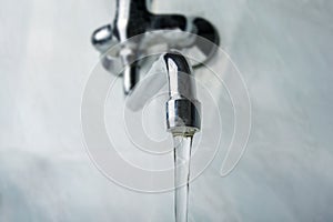 Running water faucet in the bathroom