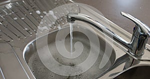 Running Water Over Kitchen Sink.