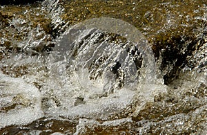 Running water over rocks